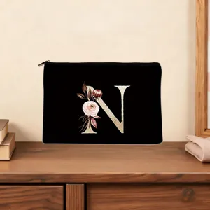 Custom floral letter N black cosmetic bag makeup clutch purse with smooth zipper closure.
