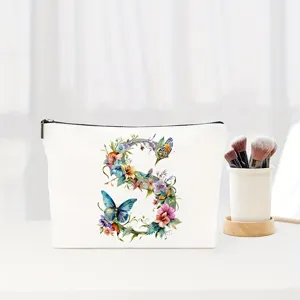 Floral letter S canvas makeup pouch, elegant cosmetic storage bag for daily use and travel.