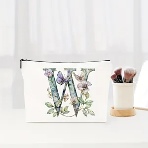 Elegant letter W print cosmetic makeup bag, floral butterfly design travel pouch for women.