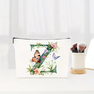 Close-up detail shot of alphabet Z canvas cosmetic makeup bag with floral butterfly print.