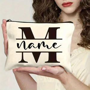 Custom canvas makeup bag detail shot showing personalized letter print and zipper closure.