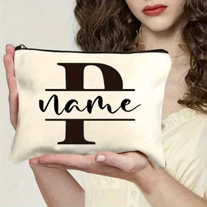 Canvas cosmetic bag zipper pouch detail showing custom letter print and neat stitching.