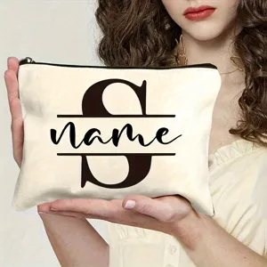 Custom canvas cosmetic bag with personalized letter S design, stylish zipper travel makeup pouch.
