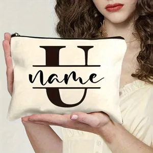 Custom canvas cosmetic bag with personalized letter U design, portable makeup pouch for women.