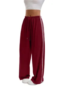 Casual wide-leg sweatpants with side stripes and drawstring waist for women comfort.