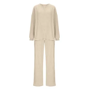 Close up view of beige ribbed knit loungewear set, V-neck top and long pants detail.