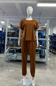 Casual solid color round neck short sleeve top and pocket trousers set for women comfort.