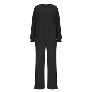 Close-up view of black ribbed knit fabric texture, highlighting the soft V-neckline finish.