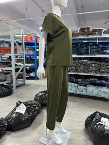Detailed view of solid color casual short sleeve top and pocket pants set on mannequin.