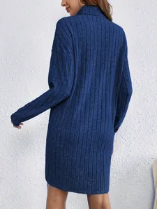 Detail view of the elegant solid color turtleneck long sleeve knit dress in blue.