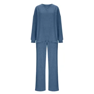 Close-up of the soft ribbed knit texture, V-neckline detail, and comfortable long sleeve.