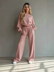 Minimalist solid color crop sweatshirt and wide leg pants matching set for women.