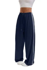 Women casual loose wide leg sweatpants with drawstring and side stripes for comfort daily wear.