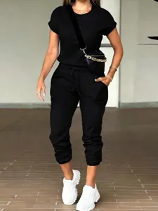 Casual women solid color short sleeve top and pocket joggers set for daily wear and fashion style.