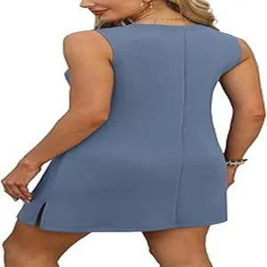Detail view of a solid blue V-neck sleeveless tank dress featuring a back slit hem.