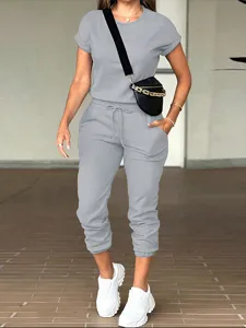 Casual solid color round neck short sleeve top and pocket jogger pants set for women.