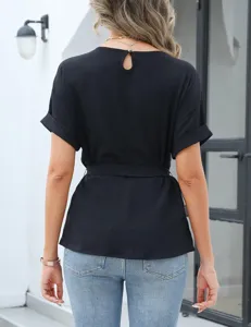 Detailed view of the back keyhole and waist belt design on the black short-sleeve top.