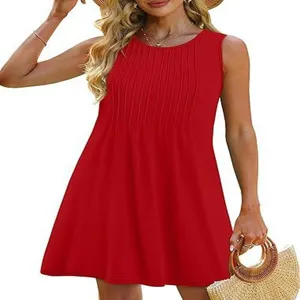Detail view of the elegant red sleeveless mini dress featuring pleated front and round neck.