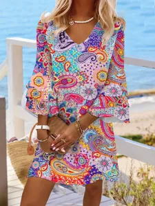 Colorful bohemian paisley print V-neck three-quarter sleeve mini dress for summer beach vacation.