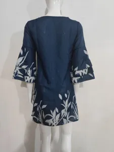 Detailed view of dark blue floral print mini dress showcasing 3/4 sleeves and hem pattern.