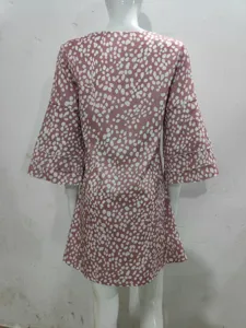 Women stylish pink print mini dress with elegant V-neck and tiered 3/4 sleeves detail view.