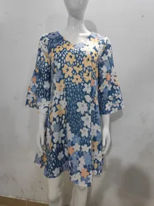 Detailed view of the blue floral print dress featuring a chic V-neck and layered 3/4 sleeves.