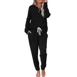 Detailed view of the black ribbed long-sleeve lounge set featuring buttons and comfortable drawstring pants.