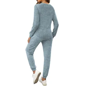 Back detail of grey-blue ribbed two-piece lounge set with long sleeves and casual pants.