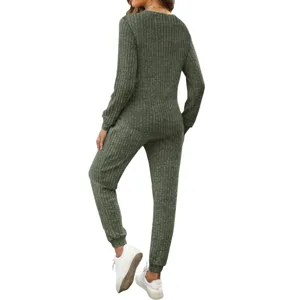 Back view detail of women long sleeve ribbed two piece lounge set in dark green with joggers.