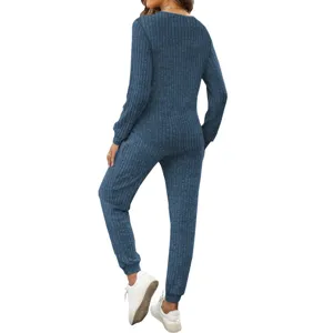 Detail view of the ribbed long sleeve top and pants lounge set in dark blue color.