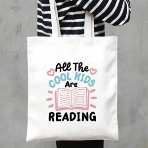 Detail shot of a large white canvas tote bag with a trendy reading quote, durable and stylish.