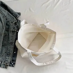 Large capacity white canvas tote bag, durable and stylish for daily travel, shopping and casual use.