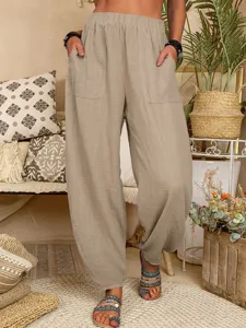 Pantalon harem ample et décontracté en lin pour femme, pantalon beige confortable taille haute.