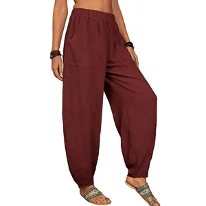 Pantalon sarouel de loisirs ample en coton et lin pour femme avec poches taille elastique.