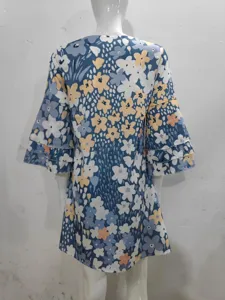 Detailed back view of casual floral print V-neck mini dress featuring tiered sleeves.