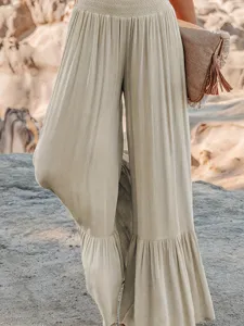 Casual pleated high waist wide leg pants detail view, summer fashion apparel showcase.