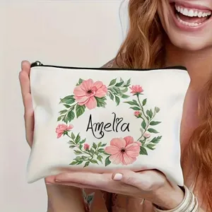 Personalized cosmetic bag with floral wreath and custom name, perfect travel makeup organizer.