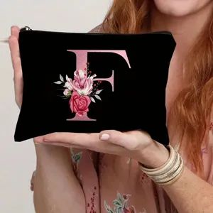 Black canvas cosmetic bag with metallic pink letter F and floral print for daily use