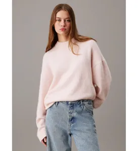 Women casual loose crewneck knit sweater in soft light pink paired with blue jeans.