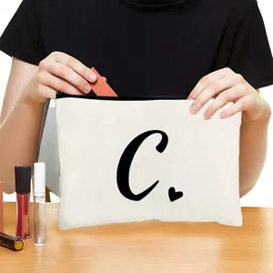 Custom canvas cosmetic bag with zipper and black letter print for daily makeup storage.