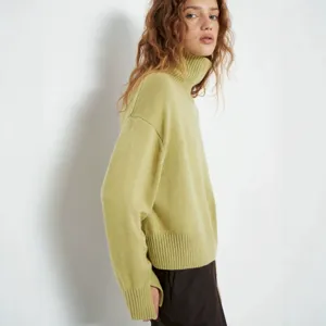 Detailed view of women high neck knit sweater in chartreuse, soft texture, cozy winter style.