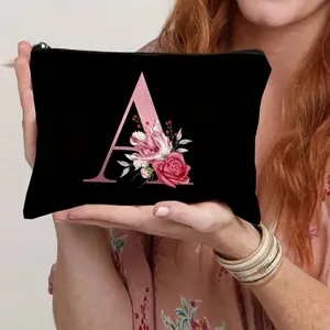 Canvas cosmetic bag with letter A and floral print detail for daily storage and travel use.