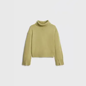 Close-up detail of women turtleneck sweater, lime green knitwear with slit cuff design.