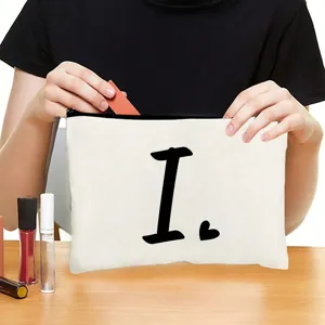 White canvas cosmetic bag with black letter print, portable zipper pouch for daily travel makeup.