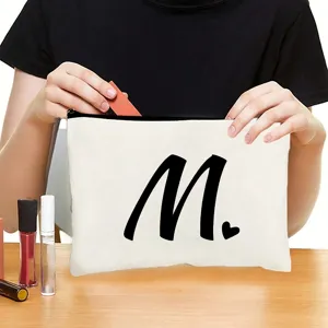 Custom white canvas zipper makeup bag with black letter print for travel cosmetics storage.