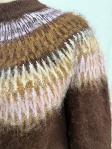 Close-up view of cozy fuzzy Fair Isle knit sweater featuring a soft brushed colorful pattern.