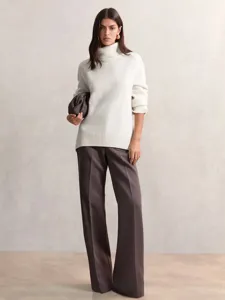 Women's white turtleneck sweater, loose knit pullover, autumn and winter fashion apparel detail shot.