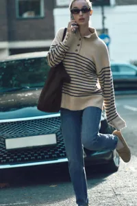 Detailed view of women's autumn winter striped mock neck knit sweater stylish casual wear.