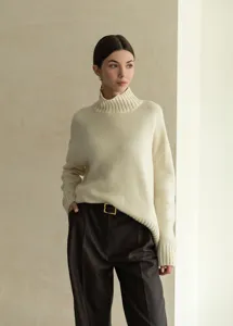 Women mock neck oversized knit sweater detail view, cozy autumn winter pullover top.