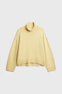 Casual pale yellow turtleneck knit sweater for women, comfortable loose cropped design.